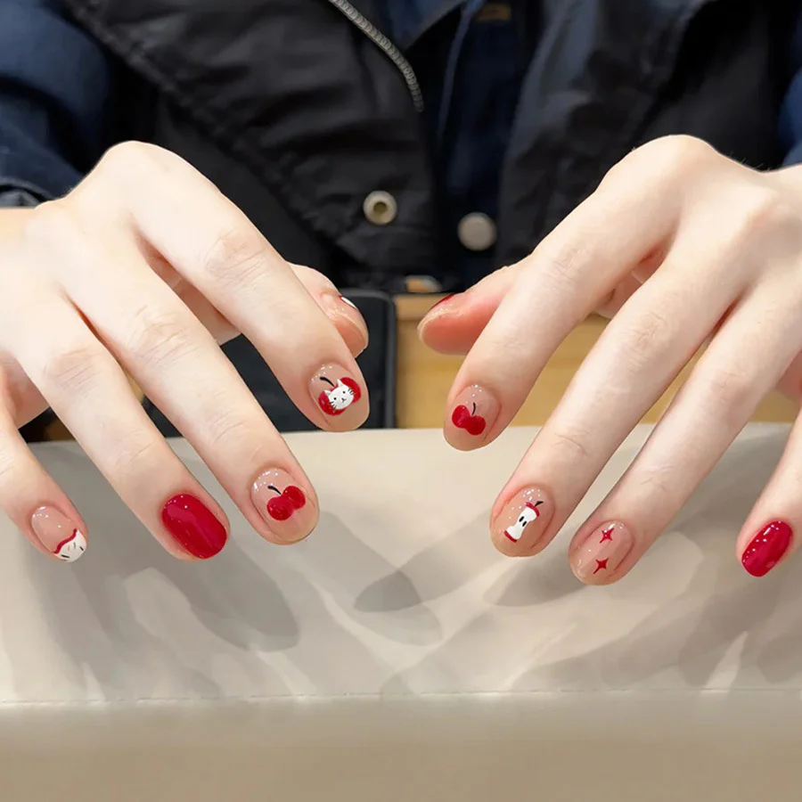 Charming Cherry Blossom Press-On Nail Set in Short Round Shape Vibrant Red with Cute Bunny and Star Design
