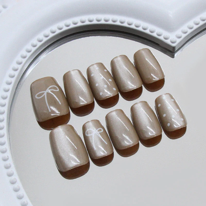 Chic Celebration Elegant Short Square Neutral Beige Nails with Whimsical Bow and Polka Dot Design