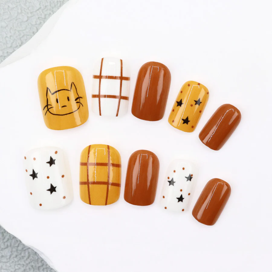 Cozy Autumn Vibes Short Square Yellow and Brown Patterned Press On Nail Set Featuring Cute Cat and Star Designs