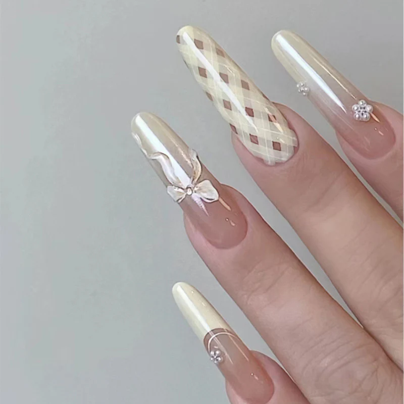 Elegant Charm Long Oval Light Beige Press On Nail Set with Intricate Floral and Plaid Designs