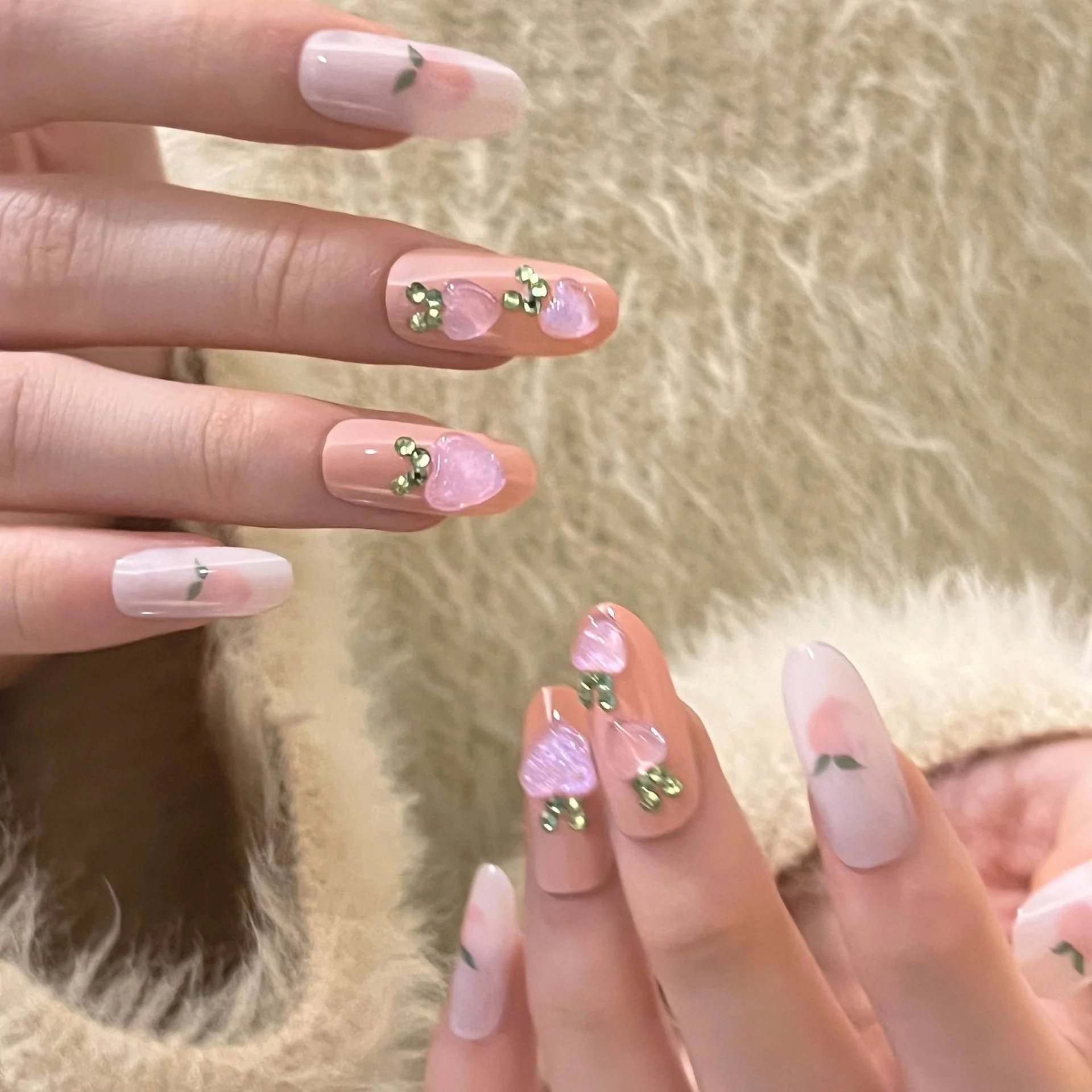 Enchanted Garden Long Oval Translucent Press-On Nails with Green Leaf Accents and Pink Heart Gemstones