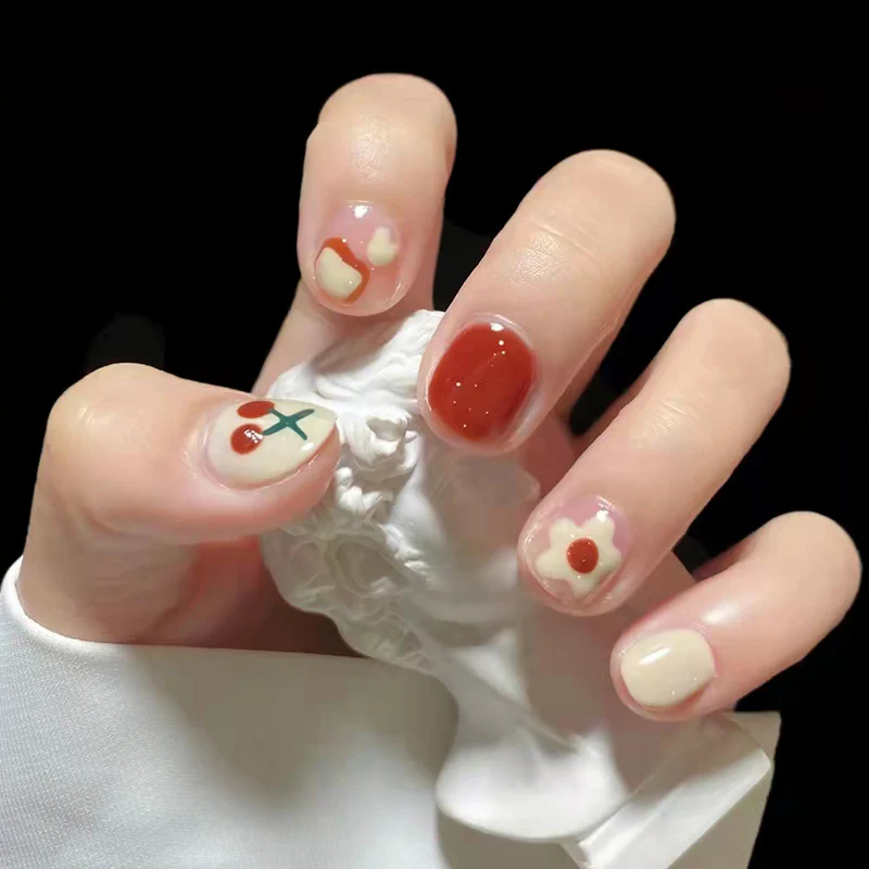 Enchanted Valentine's Day Short Round Press-On Nail Set in Romantic Red and Cream with Adorable Heart Accents