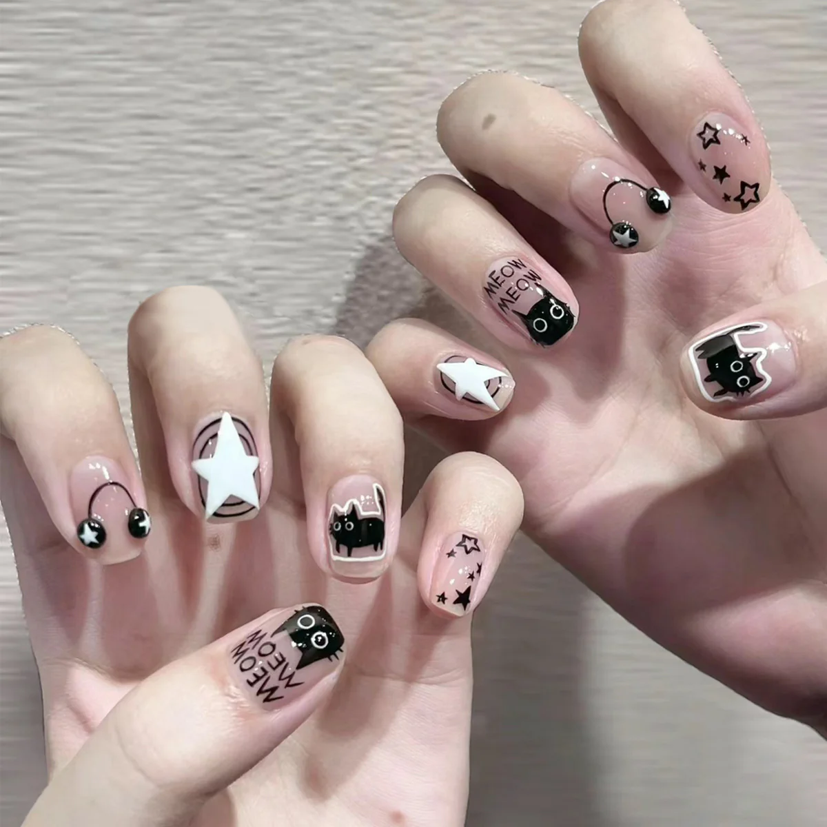 Enchanting Feline Fantasy Short Squoval Pink and Black Nail Set with Adorable Cat and Star Designs