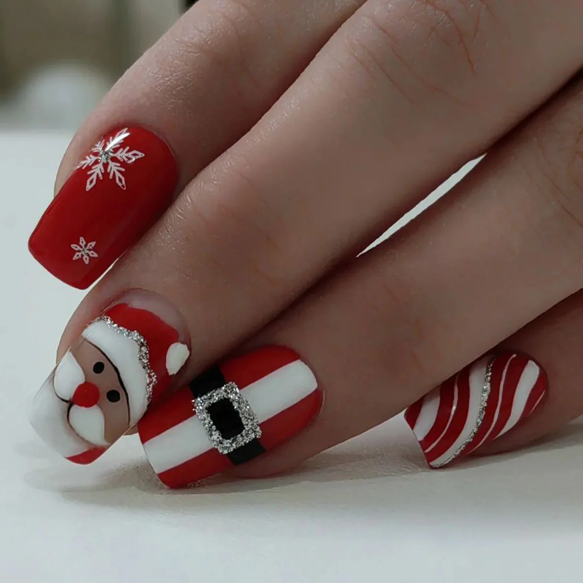 Festive Cheer Medium Square Red Nails with Santa and Snowflake Designs