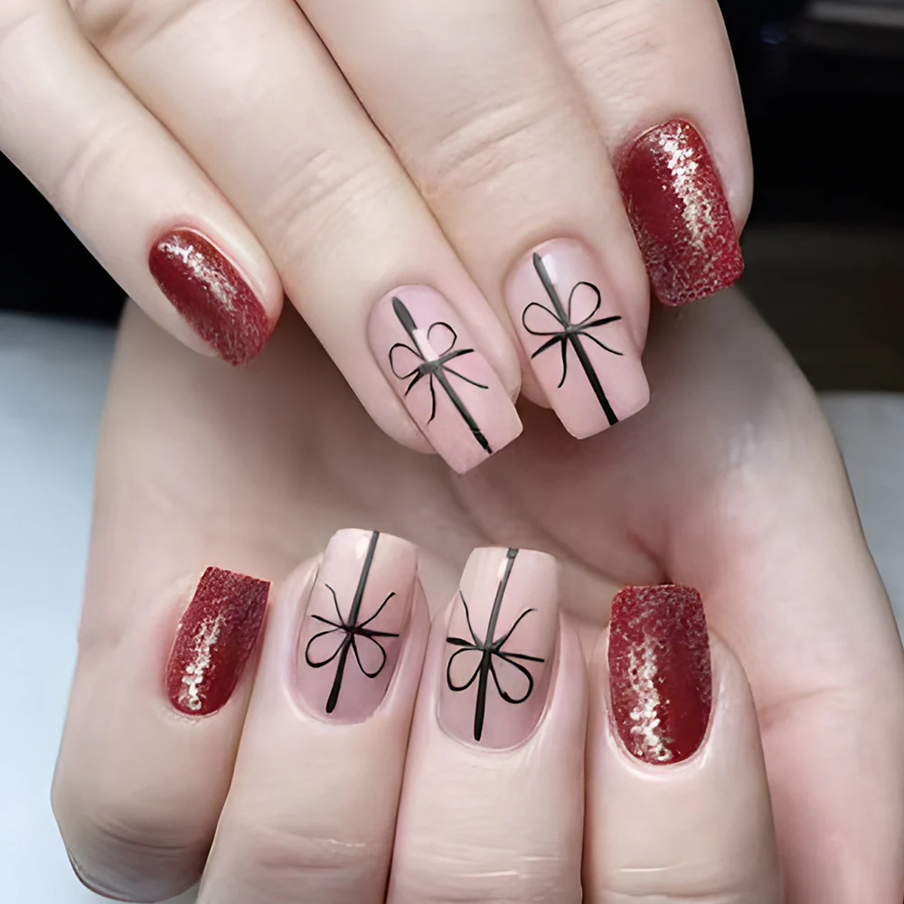 Gifted Elegance Press-On Nail Set Featuring Medium Square Blush Pink with Bow Design and Sparkling Red Accent