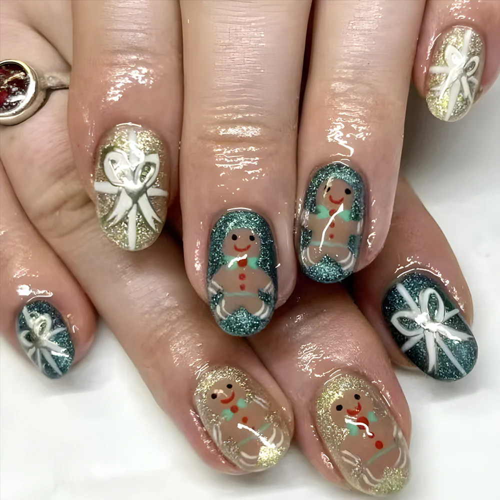 Gingerbread Delight Short Oval Glittery Green and Gold Press-On Nail Set with Festive Hand-Painted Decorations