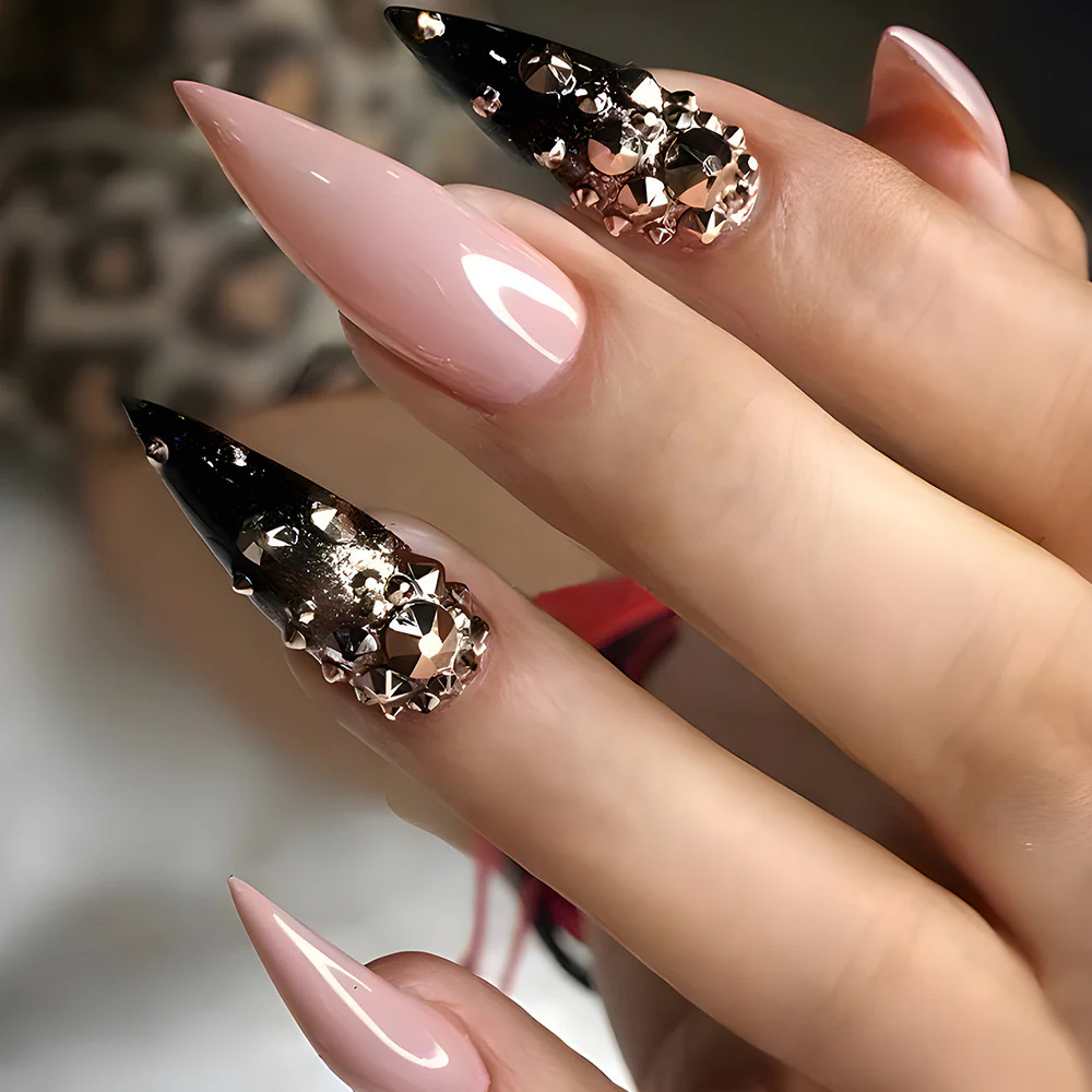 Glamourous Long Stiletto Gradient Nails with Bold Black Tips and Luxe Gemstone Accents