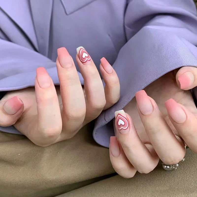 Modern Minimalist Medium Coffin Peach Press On Nails with Geometric Heart Accents