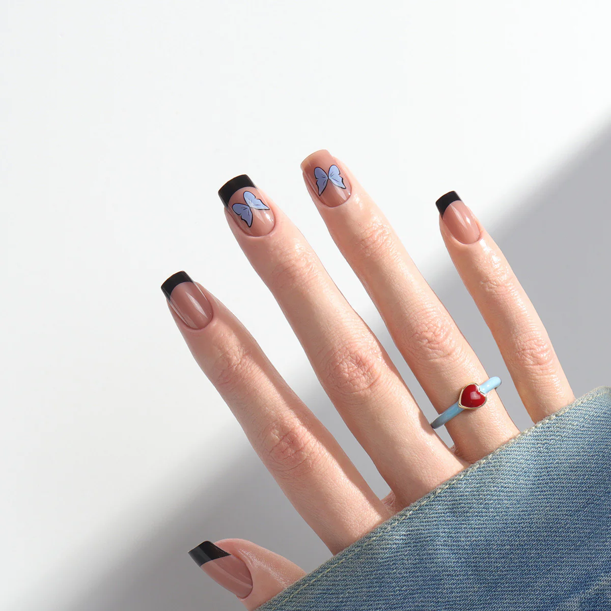 Modern Monarch Medium Square Press On Nails in Beige with Black Tips and Blue Butterfly Accents
