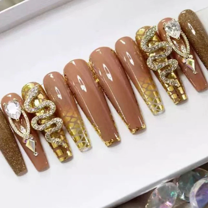 Regal Serpent Extra Long Coffin Camel Press On Nail Set with Golden Glitter, Snake Design, and Jewel Embellishments