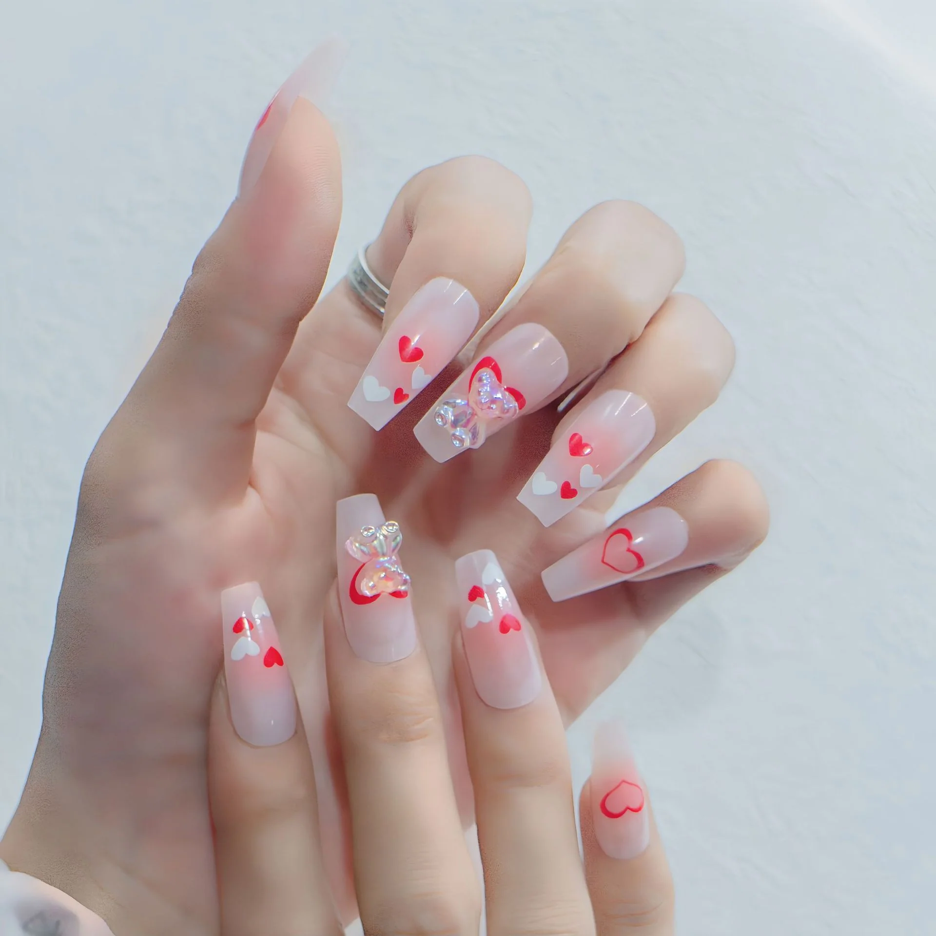 Romantic Heartfelt Lengthy Coffin Gel Press On Long Nail Set in Transparent Pink Featuring Colorful 3D Heart and Butterfly Accents