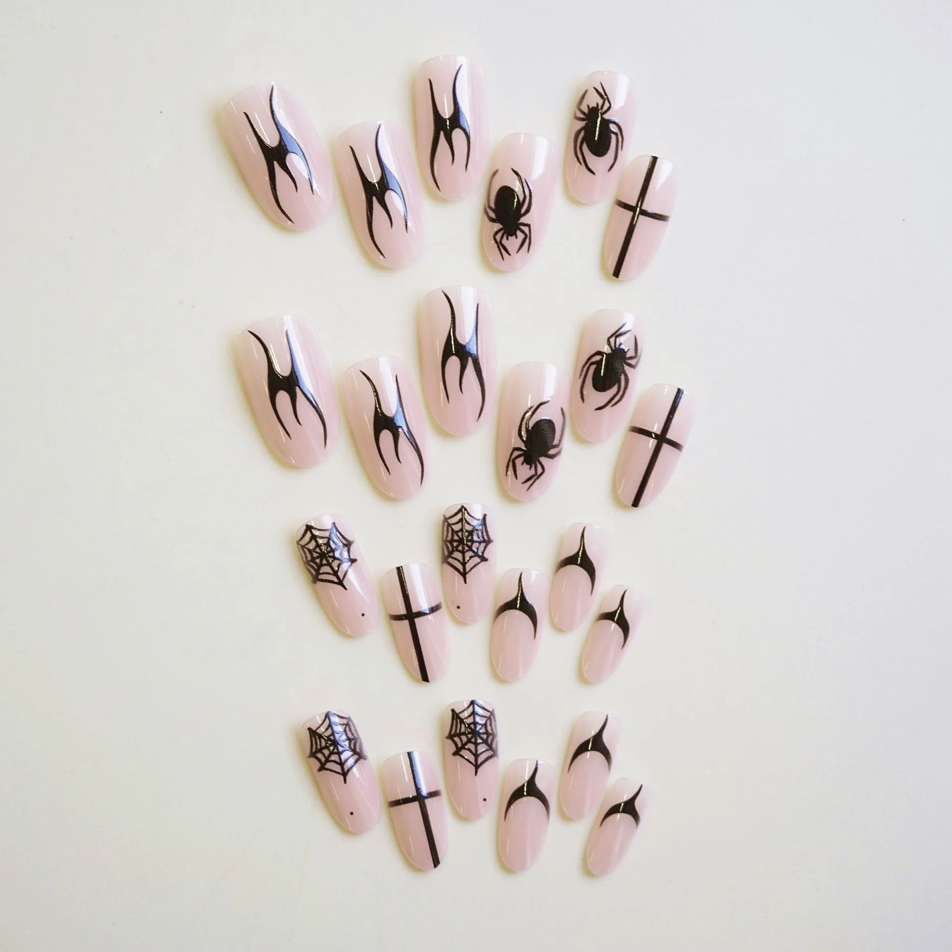 Spooky Elegance Long Almond Pink Press On Nail Set Featuring Intricate Black Spider and Spiderweb Designs