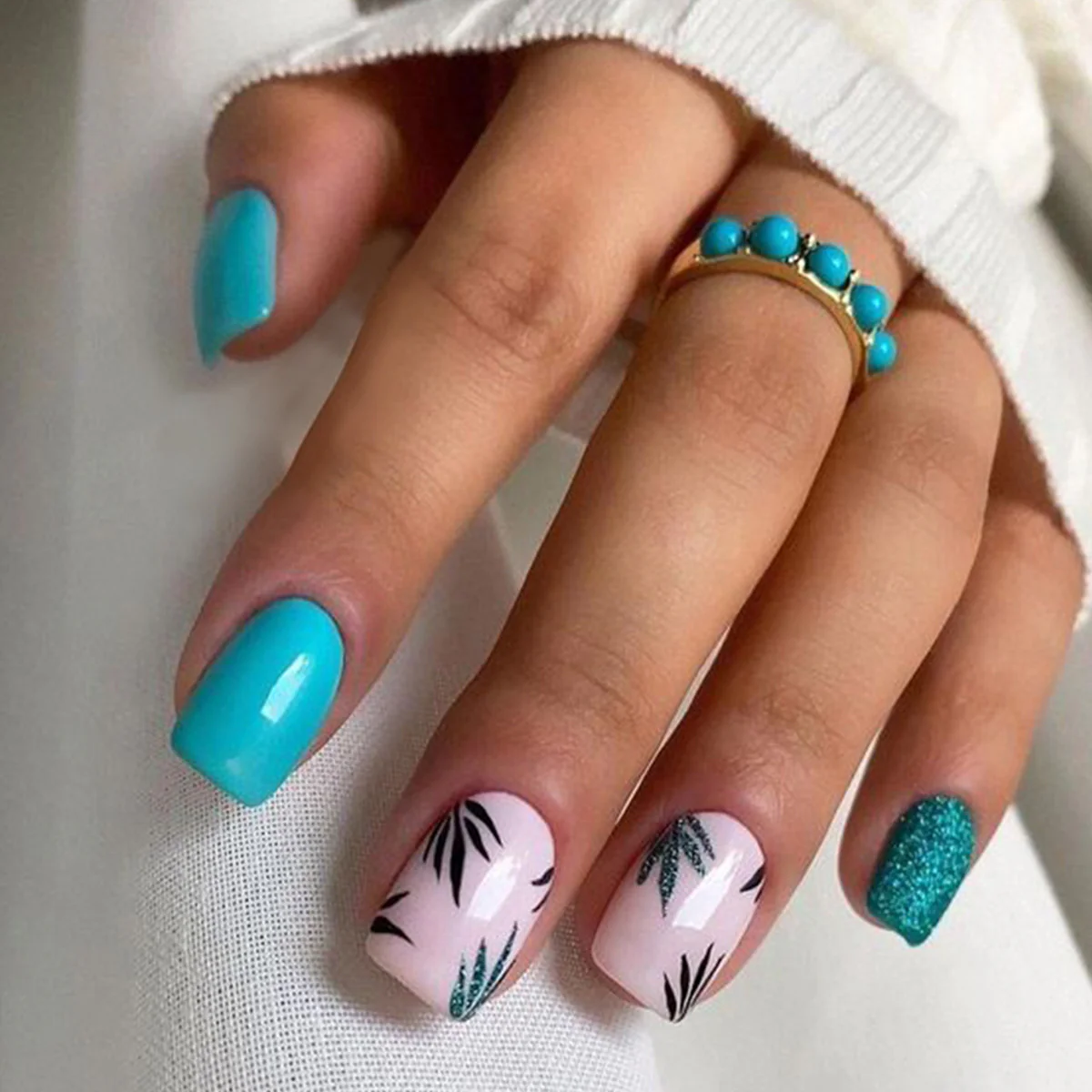 Tropical Oasis Short Square Teal Glossy Nails with Glittery Accent and Leafy Design