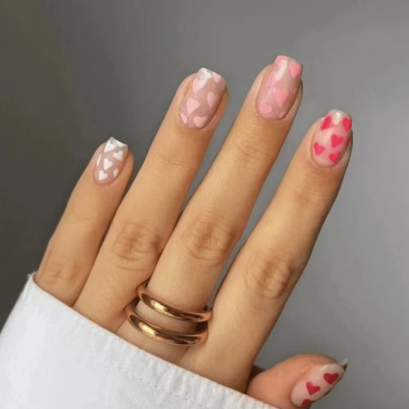 Whimsical Affair Medium Square Blush Pink Press-On Nails with Playful Heart Patterns